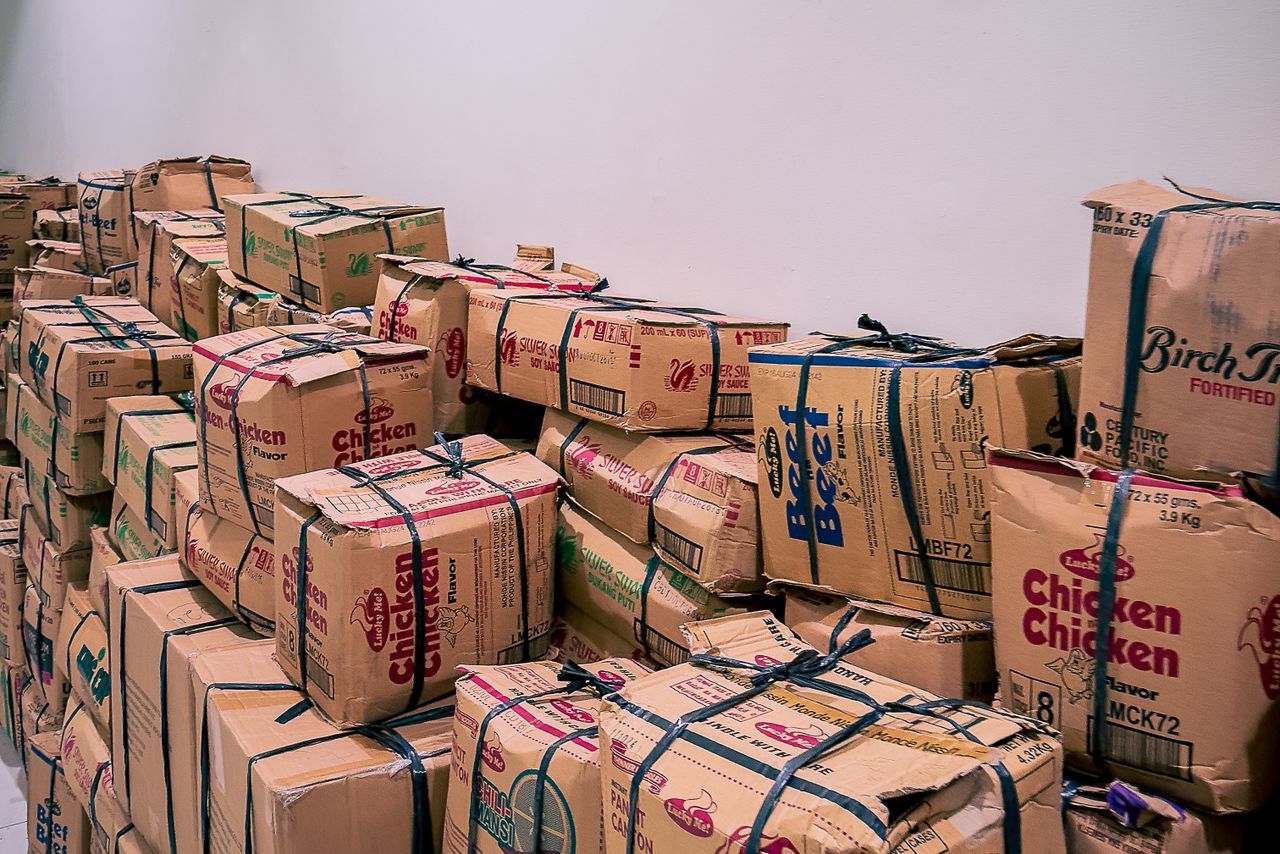Corrugated export cartons stacked in the Padma Accessories warehouse