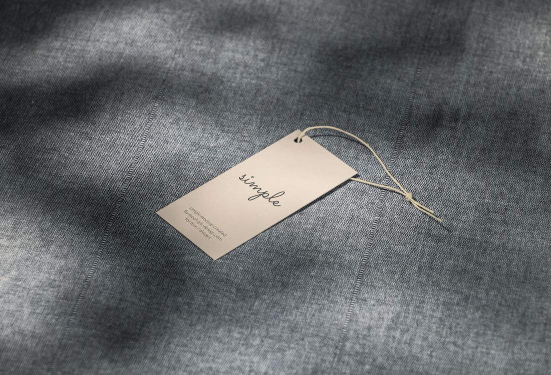 Folded garment with a printed price ticket showing a barcode, size and price