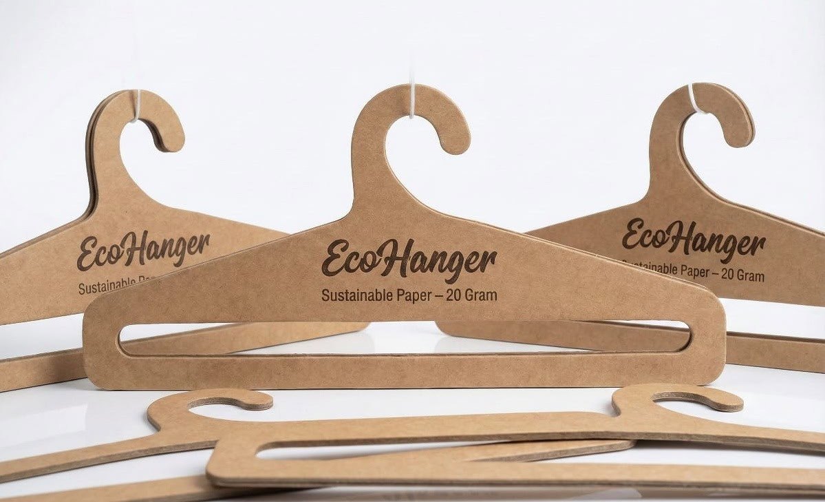 Recyclable kraft paperboard garment hangers with die-cut wave hooks, made by Padma Accessories